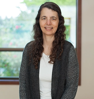 Laura Yedwab, a Guild Certified Feldenkrais practitioner in Kirkland, seated in her studio